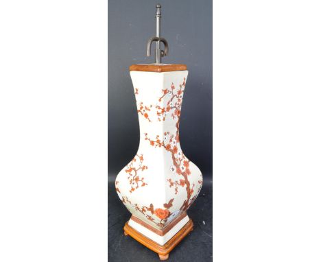 A vintage 20th century Chinese ceramic table lamp being converted from a Chinese vase having a beige ground with painted cher