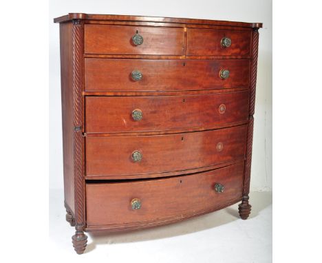 19th century Regency mahogany large bow front chest of drawers. Raised on shaped legs with spiral columns to the sides having