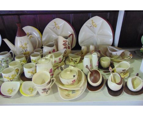 An extensive collection of Carlton wares including cream ground coffee wares with yellow floral design including coffee pot, 