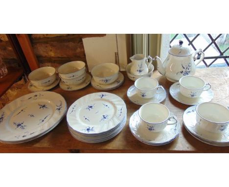 A collection of Villeroy & Boch dinner and tea wares with blue painted stylised floral decoration comprising teapot, milk jug