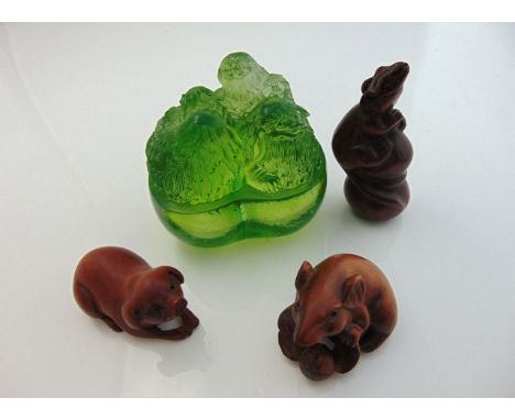 A Chinese green glass paperweight with temple dog detail, signature to base - 1999 525/1899 together with three fruitwood net
