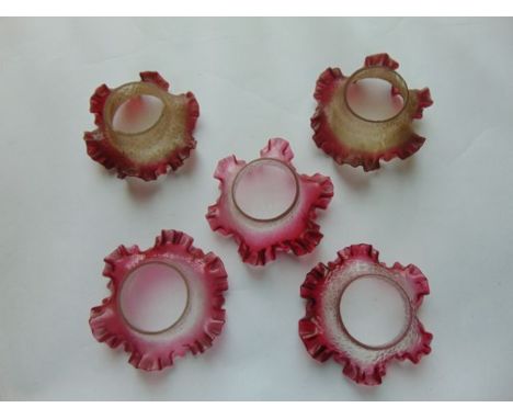 Five small Victorian glass lamp shades with cranberry tinted flared rims of textured finish