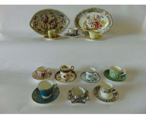 A quantity of various decorative coffee cans and saucers including Wedgwood example in the early 19th century manner with sil