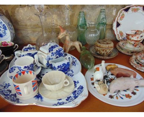 A collection of ceramics and glassware including a 19th century Belleek cup and saucer of shell moulded form with black print