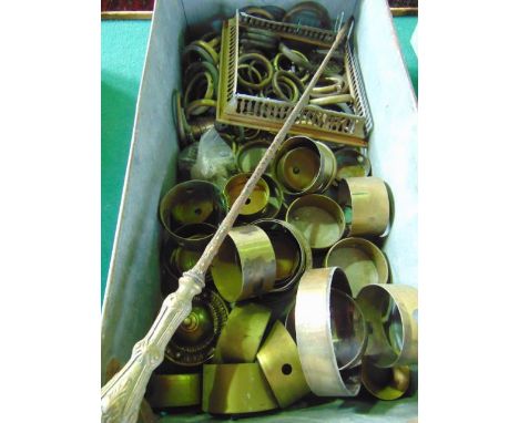 A vintage industrial aluminium tray of rectangular form with looping handles containing a quantity of vintage brass curtain r