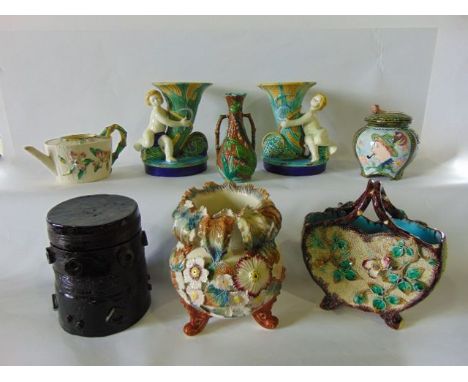 A quantity of 19th century and other majolica type wares including a basket of two sided form with encrusted floral decoratio