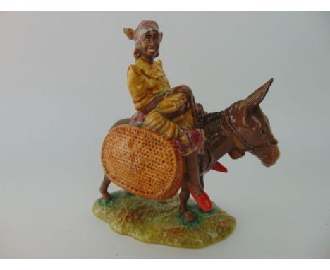 A Beswick model of a woman riding on a donkey - Suzie, Jamaica, with impressed and printed marks to base numbers 1347