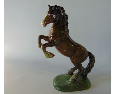 A Beswick model of a rearing brown shire type horse with printed and impressed marks to base numbers 1014