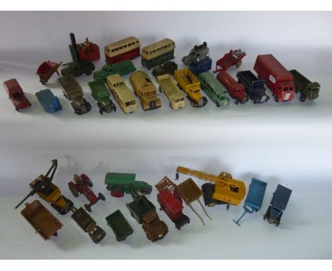 A quantity of vintage die cast model vehicles by Dinkey to include double decker buses, flat bed vans, a tractor, a Bedford r