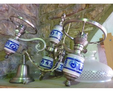 A three divisional electrolier in the form of oil lamp burners with German ceramic founts