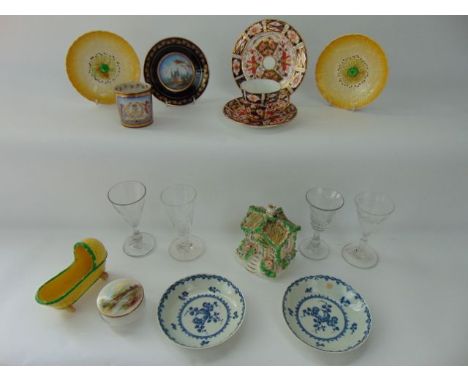 A collection of ceramics including a pair of 18th century blue and white printed saucers with fruit and floral sprig decorati