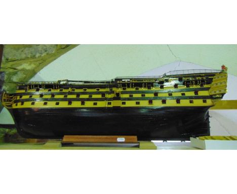 A substantial painted timber model of a 100 gun galleon labelled Victory, with brightly painted finish, complete with related