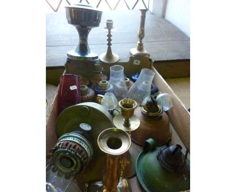 A box containing an assortment of ceramic lamp fonts, further lamp bases, chimneys etc