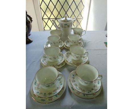 A collection of Minton's Fragrance pattern tea wares with blue, pink and green floral border detail comprising teapot, milk j