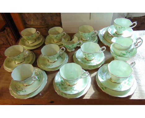 A collection of Royal Albert Laurentian Snowdrop pattern tea wares comprising a pair of cake plates, milk jug, sugar bowl, el