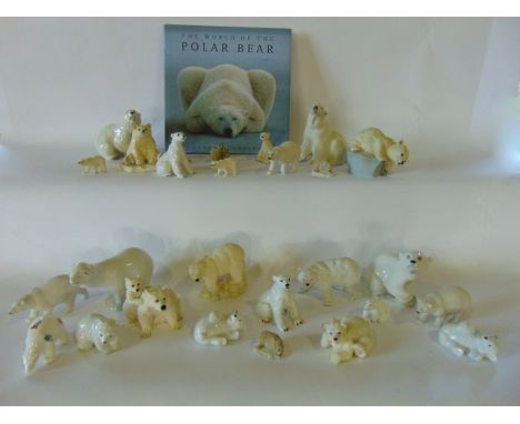 A collection of ceramic and resin models of polar bears including USSR examples together with The World of the Polar Bear by 