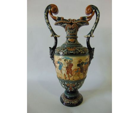 A late 19th century German majolica two handled vase by Gerbing & Stephan with incised and painted continuous panel showing a