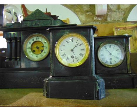A large Victorian black slate mantel clock of architectural form together with two similar black slate and marble mantle cloc
