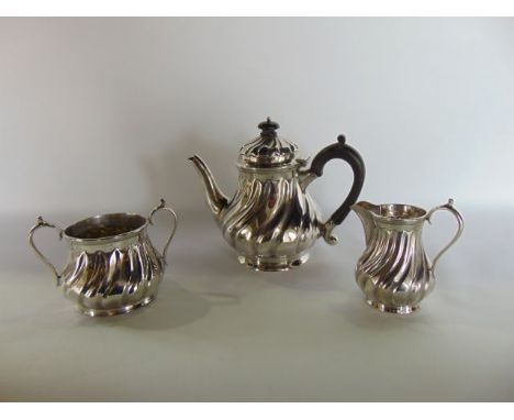 A Victorian silver three-piece tea set, Henry Stratford, Sheffield, 1888 - 1889, comprising: a teapot, a milk jug and a sugar