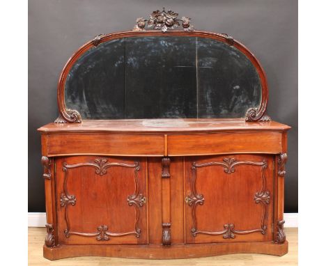 A Victorian mahogany large chiffonier or sideboard, shaped mirror back half-gallery, the frame carved and applied with a frui