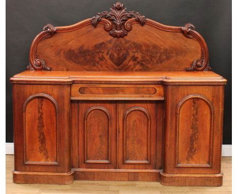 A Victorian mahogany inverted break-centre sideboard, substantial half gallery carved with scrolls and acanthus, moulded top 