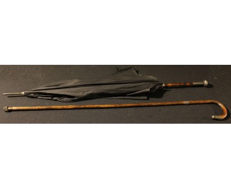 An early 20th century silver mounted palmwood walking stick; an Edwardian silver mounted umbrella, London 1901 (2) 