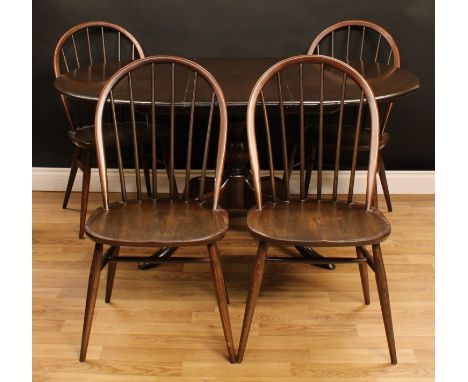 An Ercol elm extending dining table, one additional leaf, baluster column, cabriole legs, 72.5cm high, 111cm extending to 149