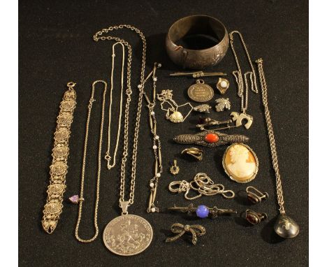 A sterling silver hinged bangle; a Siam silver necklace and pendant; an Israeli silver pendant and necklace; a pair of sterli