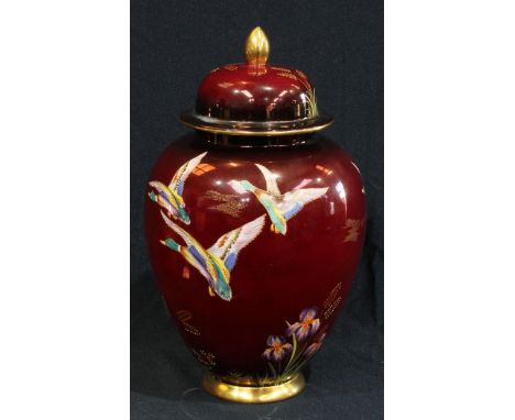 A Carlton Ware rouge royale lustre vase and cover, decorated with ducks and irises, 28cm high 