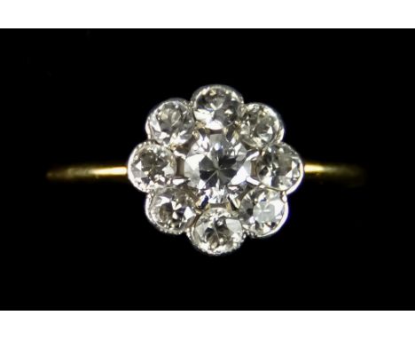 An 18ct Gold Flower Head Diamond Ring, set with brilliant cut white diamonds, approximately 1.25ct, size L, gross weight 2.7g