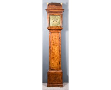 An 18th Century Figured Walnut Longcase Clock, by Thomas Carter of London, the 12ins square brass dial with Roman and Arabic 