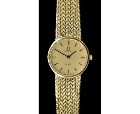 A Lady's Quartz Wristwatch, by Omega, Model de Ville, plated case, 20mm diameter, gold dial and baton numerals, with conformi