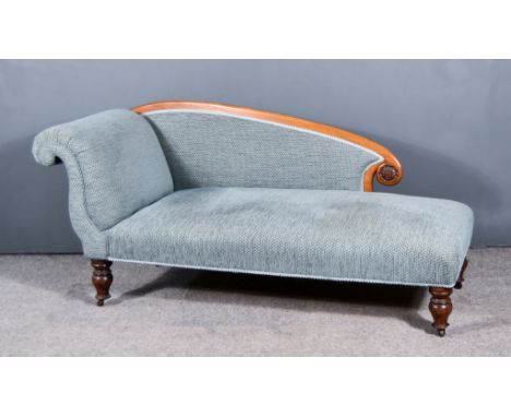 A Victorian Mahogany Framed Scroll End Chaise-Longue, upholstered in diaper pattern blue cloth, on turned legs and castors, 6