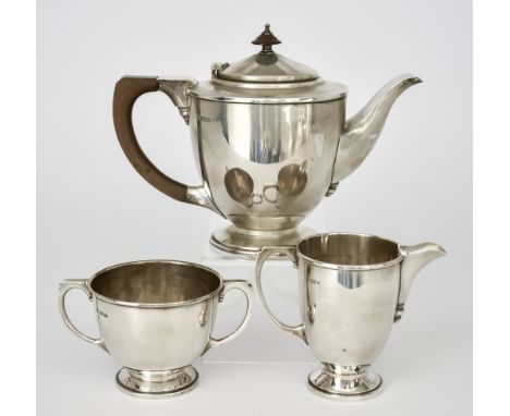 A George VI Three-Piece Tea Service, by Cooper Brothers &amp; Sons, Sheffield, 1938 and 1939, with plain circular bodies, mou