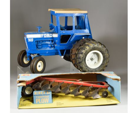 A Collection of Tractor Models, comprising - John Deere model A 1934, John Deere 4 wheel drive, No.597, a Ford 9600 dual whee
