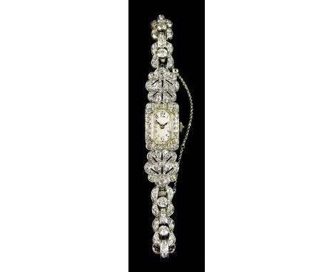 A Lady's Manual Wind Platinum and Diamond Cocktail Watch, platinum case, 15mm x 20mm, silver dial with black Arabic numerals,