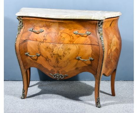 A 19th Century Continental Kingwood, Marquetry and Gilt Metal Mounted Commode of shaped outline, with grey and white veined m
