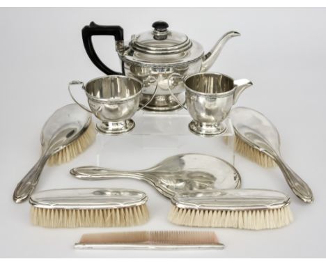 A George VI Silver Circular Three-Piece Tea Service and a Silver Backed Dressing Table Set,&nbsp;the tea service&nbsp;by A E 