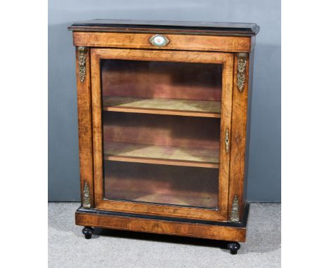 A Victorian Figured Walnut and Gilt Metal Mounted Dwarf Display Cabinet, inlaid with stringings, with oval porcelain plaque t