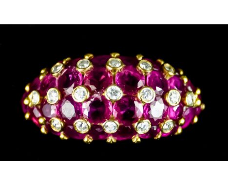 An 18ct Gold Ring, set with faceted red spinels and small diamonds, size L, gross weight 6.8g The item appears to be in condi