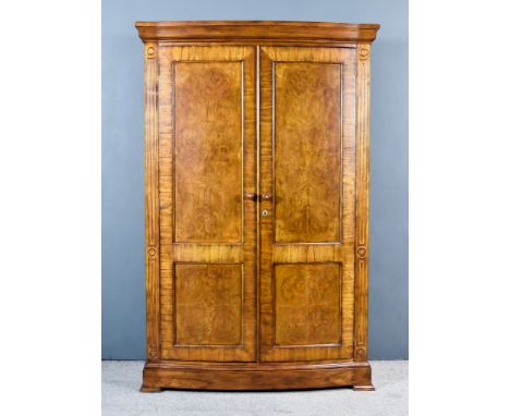 A Modern Burr and Cross Banded Walnut and Oak Wardrobe&nbsp;by Frank Hudson, with moulded edge to top, fitted hanging rail, s