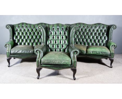 A Modern Green Studded Leather Sitting Room Suite, of Queen Anne Design, comprising - two two-seat wingback settees and a win