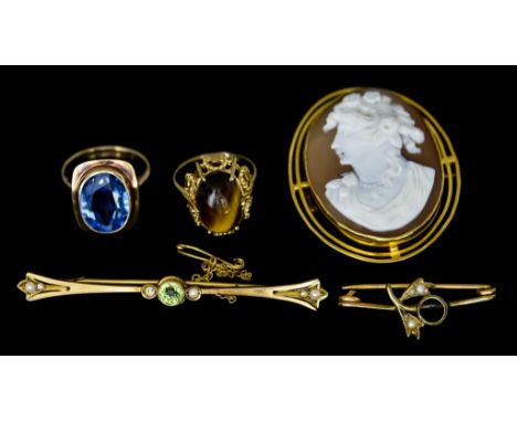 A Mixed Quantity of 9ct Gold, comprising - faceted blue topaz ring, size K,&nbsp;a seed pearl and peridot bar brooch, 60mm ov
