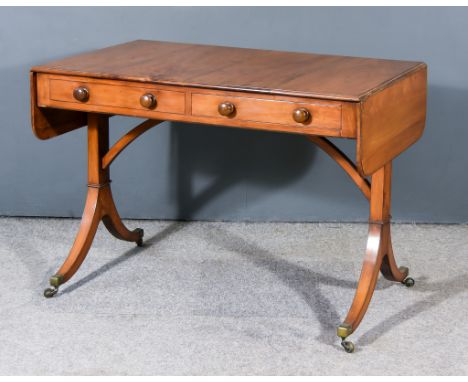 An Early 19th Century Yew Wood Rectangular Sofa Table, fitted one real and three dummy drawers, on rectangular end supports, 