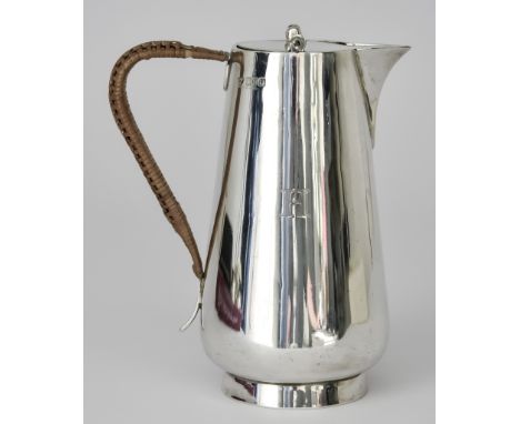 A George V Silver Water Jug by Mappin and Webb, London 1915, with flat pivot lid, tapered body engraved with initial "H" and 