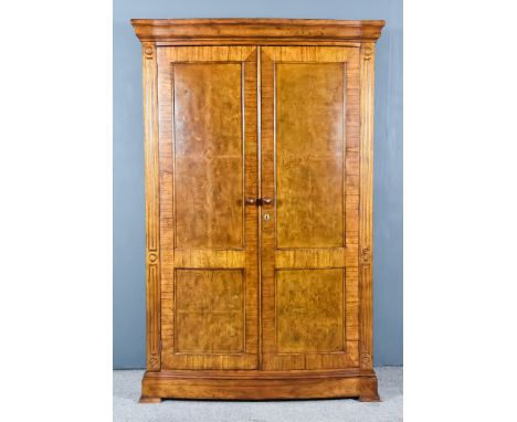 A Modern Burr and Cross Banded Walnut and Oak Wardrobe by Frank Hudson, with moulded edge to top, fitted hanging rail, shelve