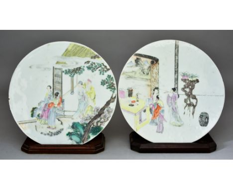 A Pair of Chinese Porcelain Circular Plaques, 19th Century, enamelled in colours with standing figures within landscapes,10.2