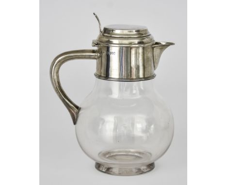 A Victorian Silver Mounted and Clear Glass Claret Jug by William Hutton &amp; Sons, London 1888,&nbsp;the flat lid with mould