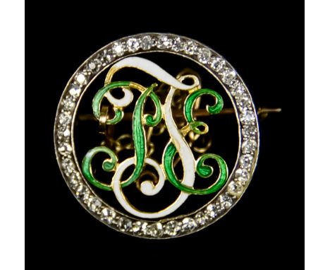 A Diamond and Enamel Circular Brooch, set with enamelled initials to the centre surrounded by small brilliant cut white diamo