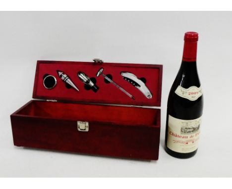 Presentation box containing a Chateau de Fleurie 2009, complete with bottle stop, corkscrew, thermometer and measure etc.